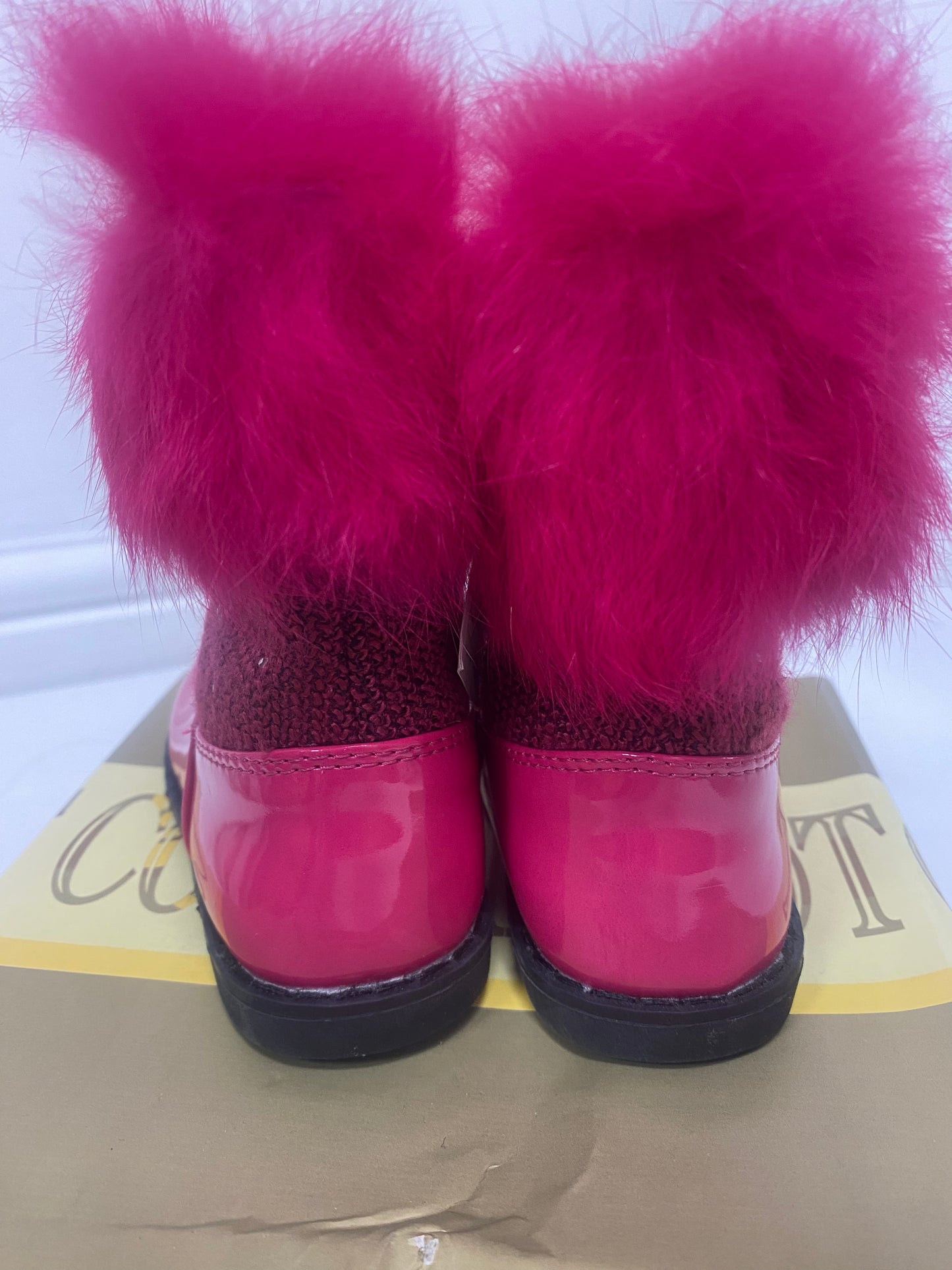 Bright pink faux fur top boots