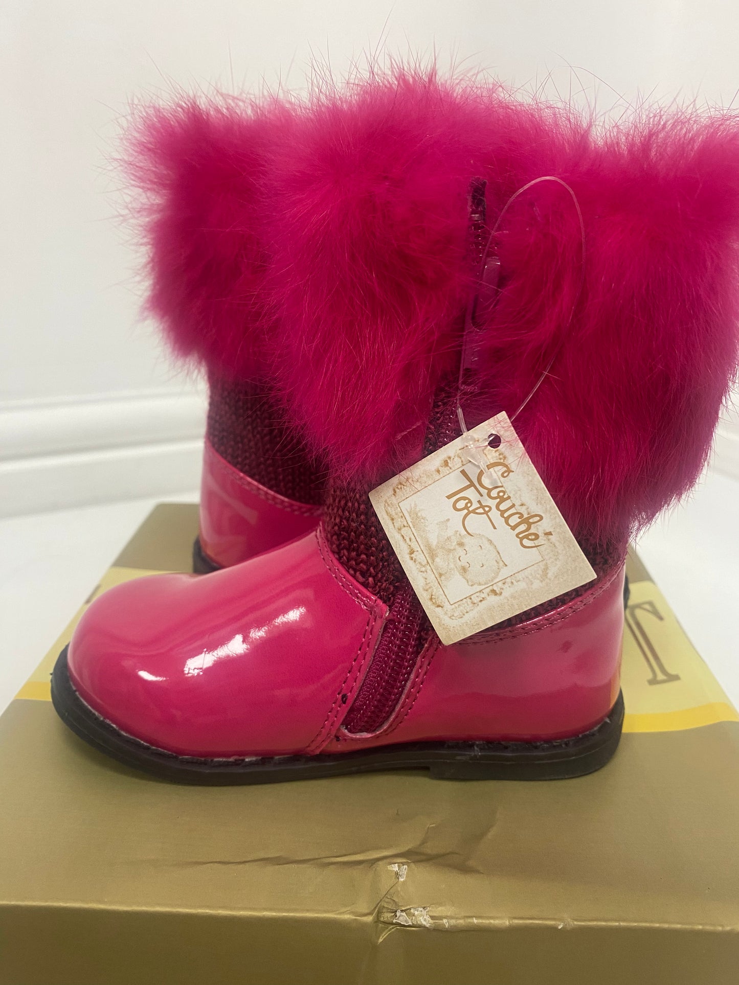 Bright pink faux fur top boots