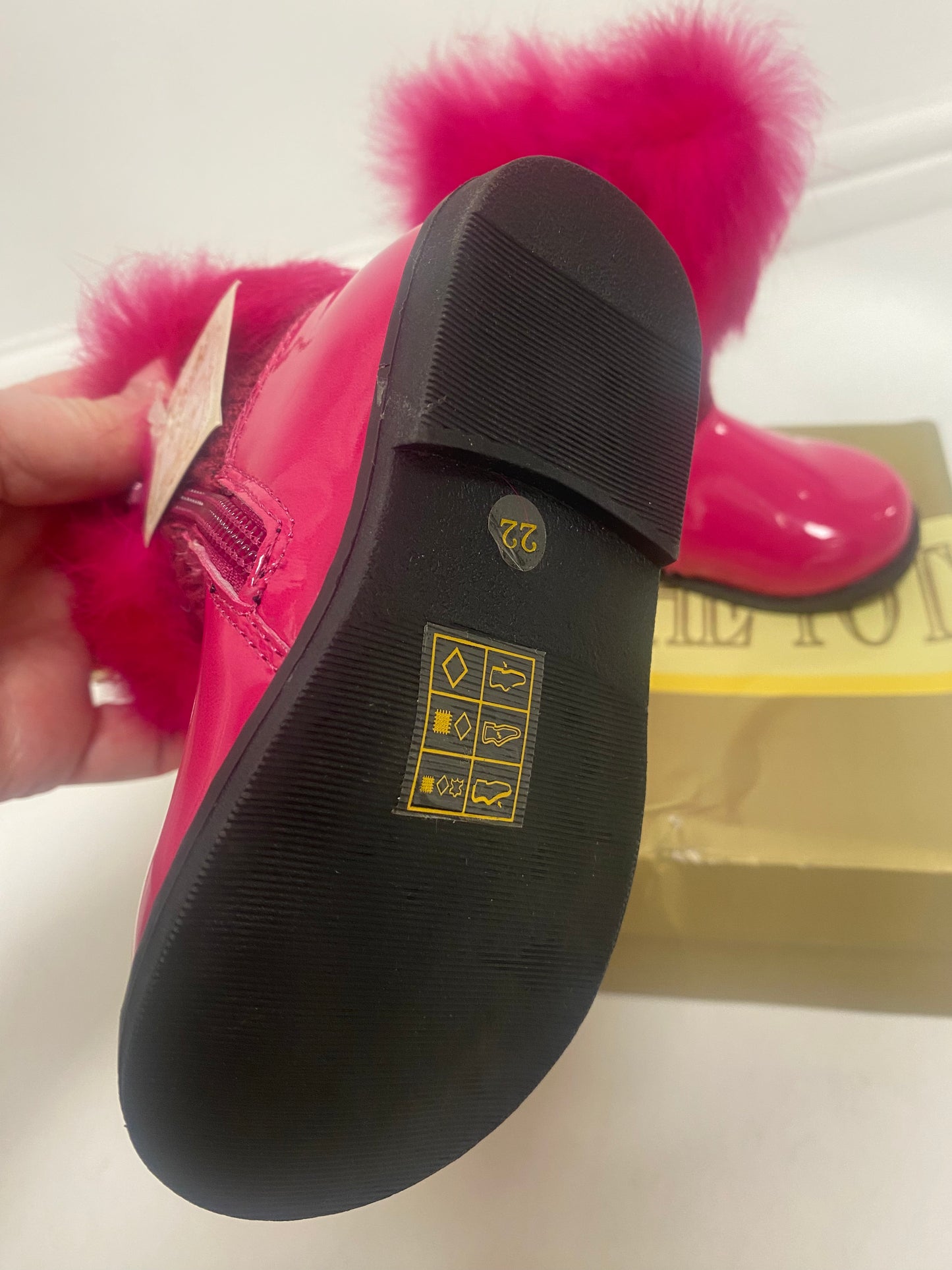 Bright pink faux fur top boots